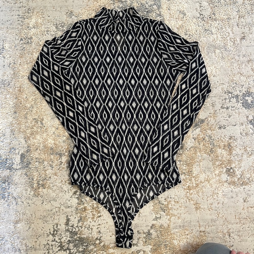 Sheer bodysuit. Size medium. Worn one time. Great condition.